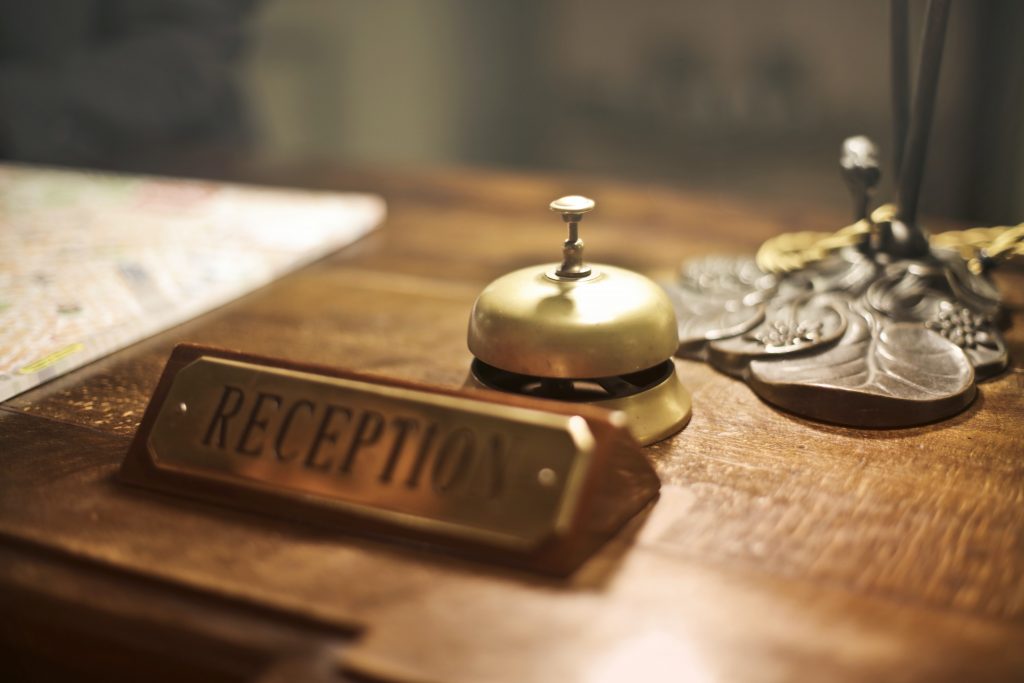 Image which shows a reception desk in a hotel