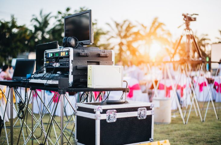 Image of an event with musical equipment in teh foreground.