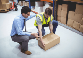 Man lifting up a box the correct way.